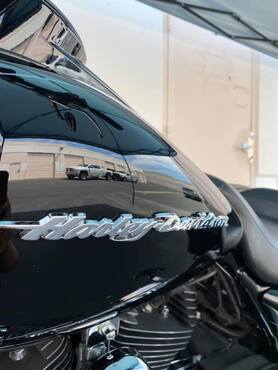 Close up of gas tank for black Harley Davidson detailed and treated with graphene self heal by ABC Mobile Detail, Granite Bay, CA
